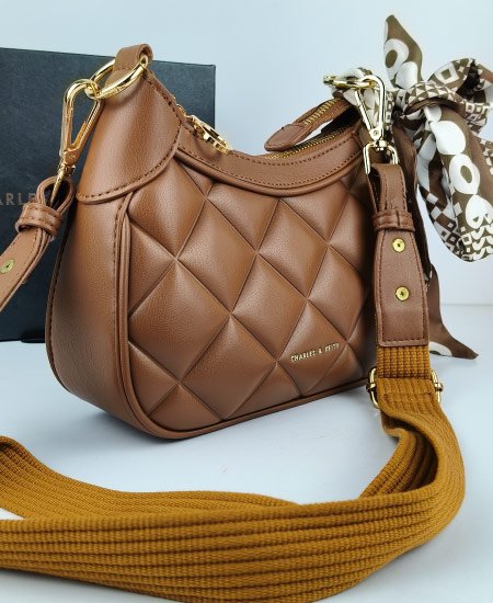Charles and Keith Moon Face Brown Handbags