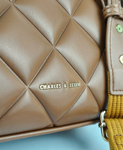 Charles and Keith Moon Face Brown Handbags